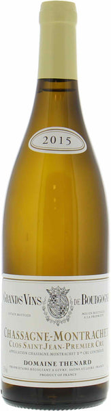 Burgundy white wine style bottle with label stating the 2015 vintage Chassagne Montrachet 1er Cru 'Clos St Jean' by Domaine Thénard, from Burgundy, France.