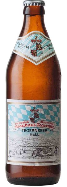 Beer style bottle with label stating HB Tegernseer Hell Beer by Herzoglich Bayerisches Brauhaus Tegernsee, from Bavaria, Germany.
